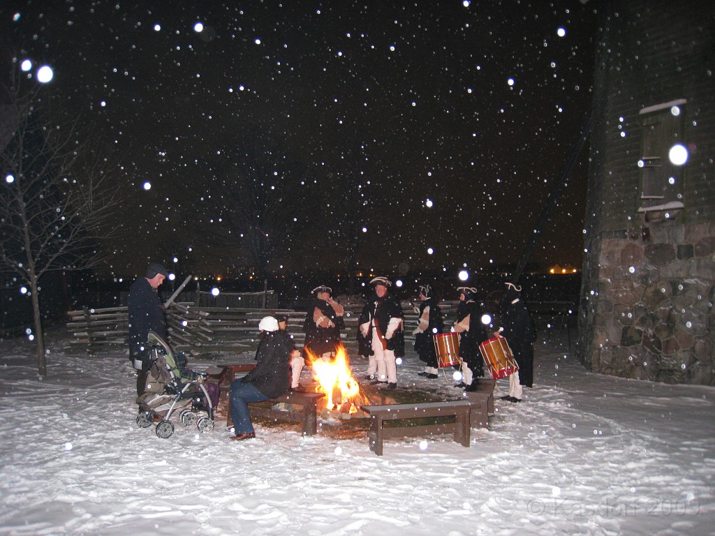 Henry Ford Christmas 2009 046.jpg - Soilders by the windmill keeping warm by the fire and telling stories to people.